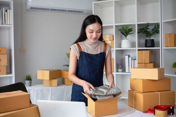 SME business entrepreneurs small in asia Preparing cardboard boxes in home office Small business operators preparing to ship to customers