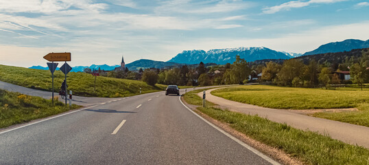 Alpine spring view with a church and the alps in the background near Teisendorf, Berchtesgadener Land, Bavaria, Germany