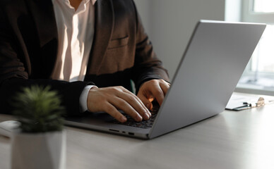 Businessman working on a laptop in the office.Concept of online communication, working, business and technology networking.