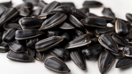 Close-up of delicious sunflower black seeds, isolated on white background