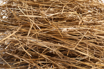 Dried straw as background, closeup. Livestock feed