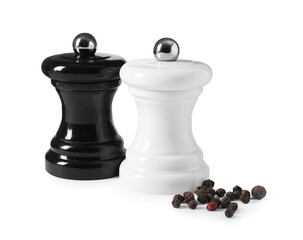 Salt and pepper shakers with grains isolated on white