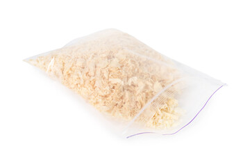 Natural sawdust in zip bag isolated on white