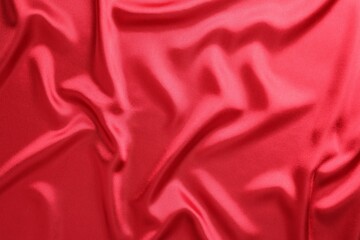 Texture of beautiful red silk fabric as background, closeup