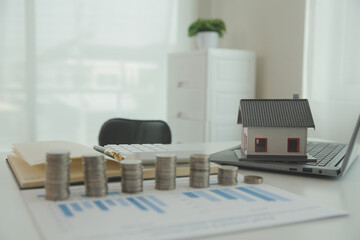 Saving money wealth concept, asian young business woman hand write management budget for saving cost, cash finance planning to spend enough money on her income for save money, payment tax, investing.