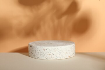 Presentation of product. Podium and shadows on orange background. Space for text