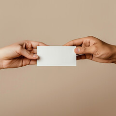 A blank business card mockup is passed from one hand to another