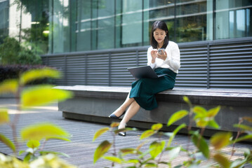 business person working with mobile phone and laptop