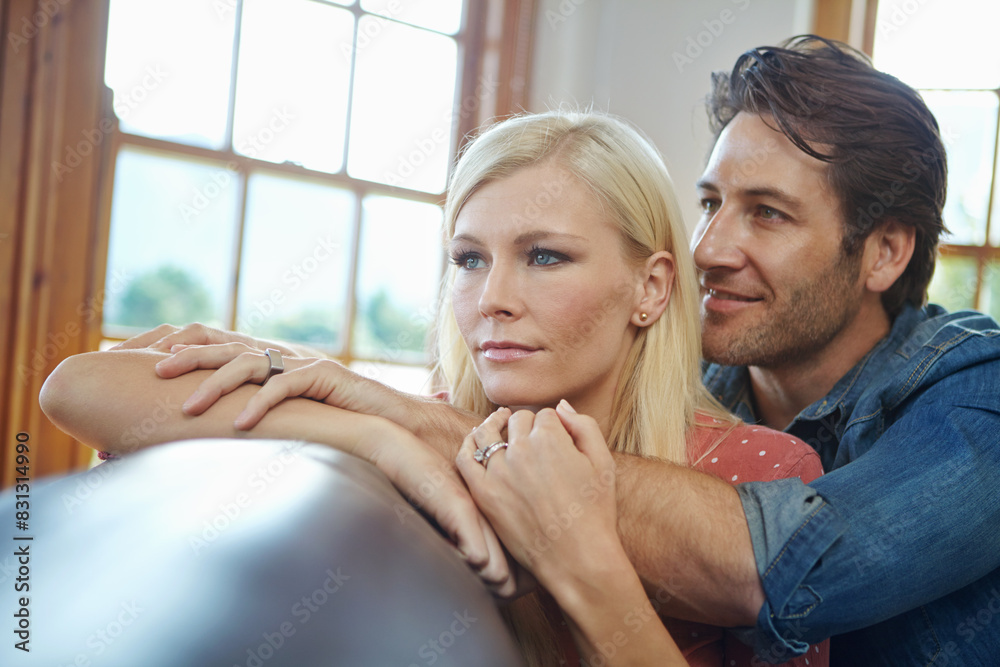 Sticker Happy, couple and hug together on sofa for time, support and bonding in dream home for marriage and future. Smile, man and woman with love embrace on couch for relationship, commitment and growth