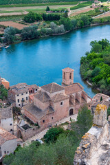 A small town with a church and a river