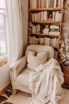 Inviting and snug reading corner adorned with a comfortable armchair and stocked bookshelves