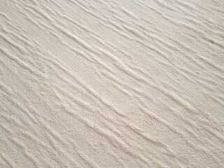 Textured beige background with wavy stripes