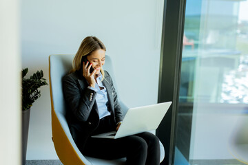 Businesswoman in modern office enjoying a productive afternoon meeting