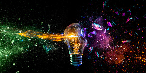 Exploding light bulb concept on dark background