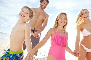 Holding hands, mother and father with children on beach for vacation, holiday and weekend trip in...