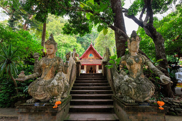 Stairs leading to Wat Pha Lat Thai Buddhist temple in jungle