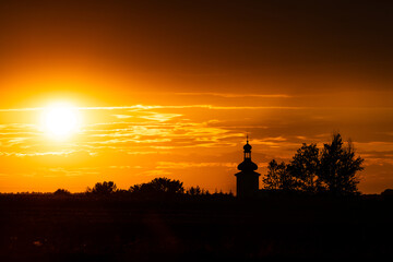 Beautiful sunset and catholic church in the background