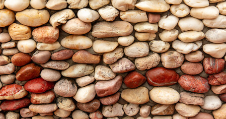 Round stones in the wall as an abstract background. Texture