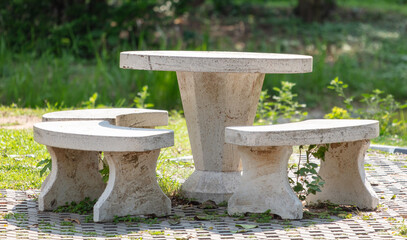 Fototapeta premium Marble table with chairs in the park