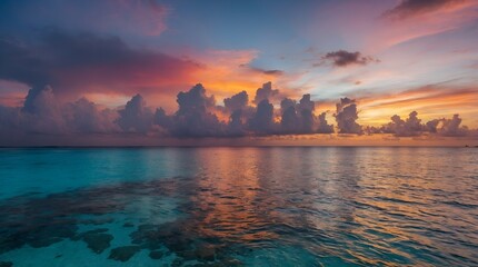 Stunning colorful sunset sky with clouds on the horizon of the South Pacific Ocean. Lagoon landscape in Moorea.