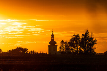 Beautiful sunset and catholic church in the background