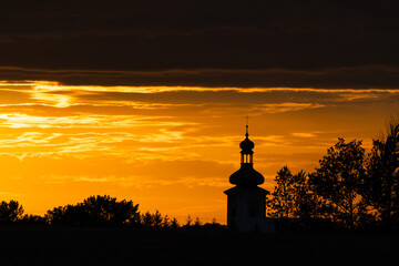 Beautiful sunset and catholic church in the background