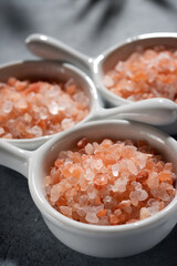Himalayan pink salt in three small ceramic cups