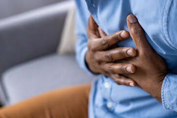 Observing an individual with an intense grip on their chest can indicate heart problems or severe...