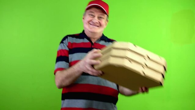 Delivery man with pizza boxes having fun, dancing.