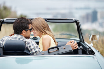 Road trip, love and couple in car in city on holiday, vacation and adventure for bonding, romance and care. Travel destination, dating and man and woman embrace for transport, journey and together