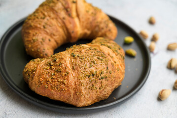 Fresh baked croissant with pistachio 
