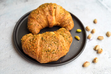Fresh baked croissant with pistachio 