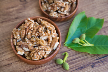 Raw Walnuts in a wooden bowl	