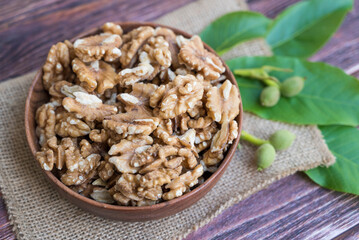 Raw Walnuts in a wooden bowl	