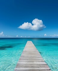 Long Wooden Pier Leading to Clear Turquoise Ocean