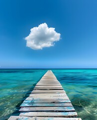 Obraz premium Long Wooden Pier Leading to Clear Turquoise Ocean