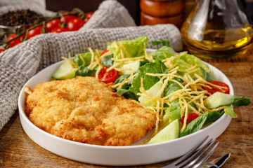 Schnitzel with fresh vegetables and salad