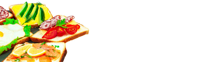 appetizing sandwiches in a gray plate on a white background. slices of bread with vegetables and meat in a plate on a light texture	