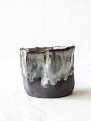 Stoneware mug with blue glaze, ideal for hot drinks. Light background. Front view.