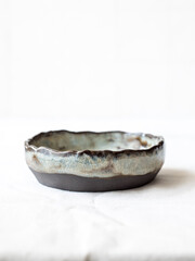 Small ceramic bowls for sauces top view. Bowls covered with glaze. Ceramic bowls on a white background. Hobby. Pottery. Handmade crafts