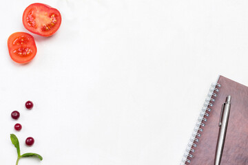 Menu background. Sprig of mint, cranberries and spring notebook