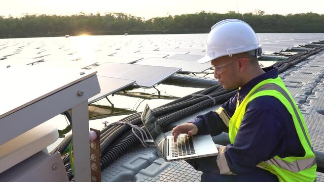 Engineer working at a floating solar farm,producing electricity for renewable energy,implementing sustainable power solutions,monitoring and maintaining solar panels to enhance clean energy generation