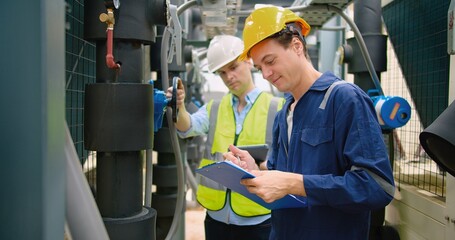 Civil engineer manager and foreman worker checking industry cooling air conditioner water cooling...