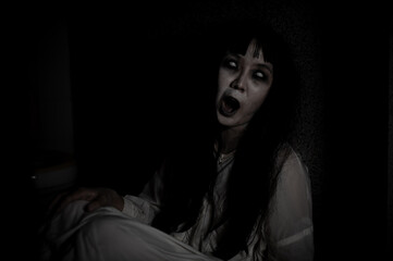 Portrait of asian woman make up ghost,Scary horror scene for background,Halloween festival...