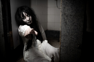 Portrait of asian woman make up ghost,Scary horror scene for background,Halloween festival...