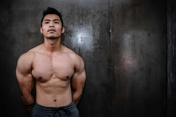 Fototapeta premium Portrait of asian man big muscle at the gym,Thailand people,Workout for good healthy,Body weight training,Fitness at the gym concept