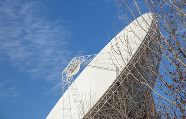 A big radio telescope in the blue sky