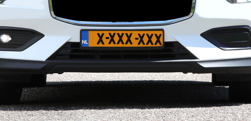 Dutch car with a license plate featuring the three Saint Andrew  s black crosses of Amsterdam XXX...