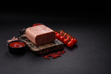 Delicious canned pink ham with salt, spices and herbs