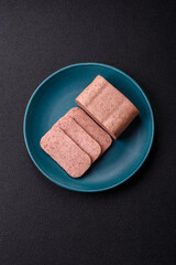 Delicious canned pink ham with salt, spices and herbs
